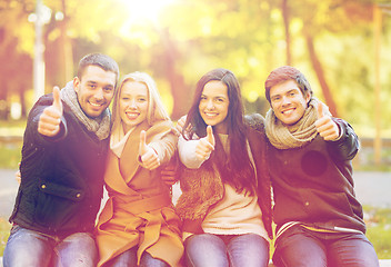 Image showing group of friends having fun in autumn park