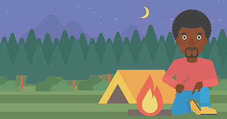 Image showing Man kindling campfire vector illustration.