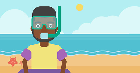 Image showing Man with snorkeling equipment on the beach.