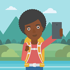 Image showing Woman with backpack making selfie.