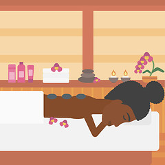 Image showing Woman getting stone therapy vector illustration.