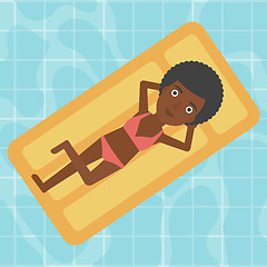 Image showing Woman relaxing in swimming pool.