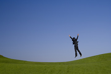 Image showing jumping high on the green