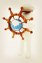 Image showing Sailor with wood steering wheel and earth. Trip around the world