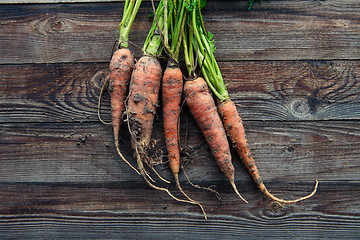 Image showing raw carrots on the ground