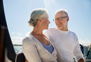 Image showing senior couple hugging on sail boat or yacht in sea