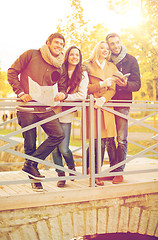 Image showing couples with tourist map in autumn park