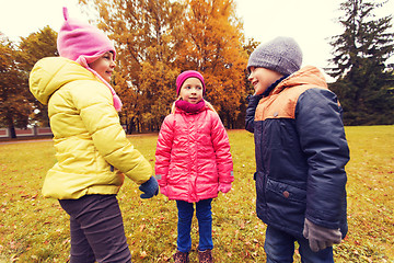 Image showing group of happy children talking in autumn park
