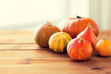 Image showing close up of pumpkins on wooden table at home