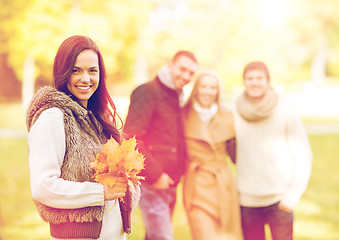 Image showing group of friends having fun in autumn park