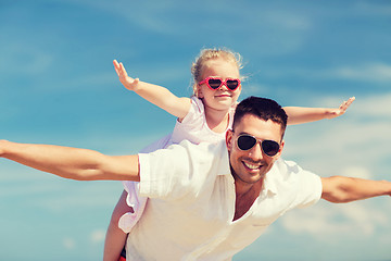 Image showing happy family having fun over blue sky background