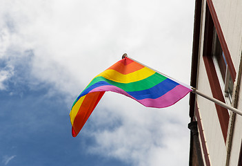 Image showing close up of rainbow gay pride flag waving on building