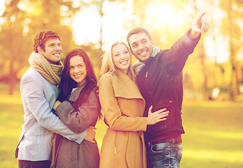 Image showing group of friends having fun in autumn park