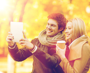 Image showing couple taking photo picture autumn park