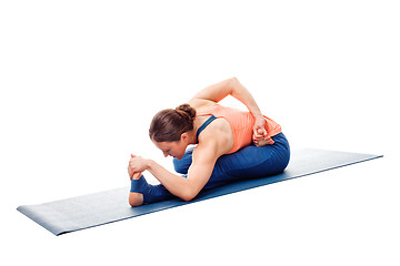 Image showing Woman doing Ashtanga Vinyasa Yoga asana Ardha baddha padma pasch