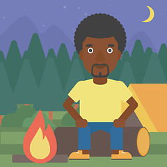 Image showing Man sitting on log in the camping.