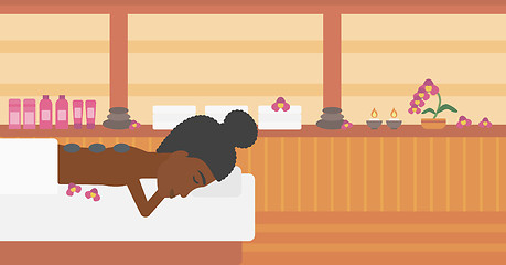 Image showing Woman getting stone therapy vector illustration.