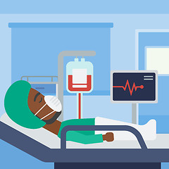 Image showing Patient lying in hospital bed with heart monitor.