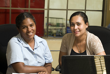 Image showing two office lady female manager workers  management office hotel 