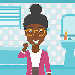 Image showing Woman brushing teeth.