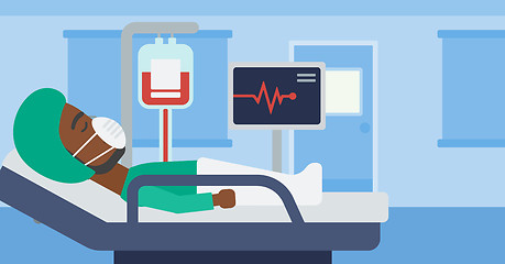 Image showing Patient lying in hospital bed with heart monitor.