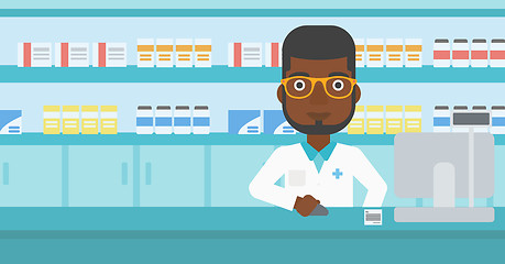Image showing Pharmacist at counter with cash box.