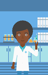 Image showing Laboratory assistant with syringe in lab.