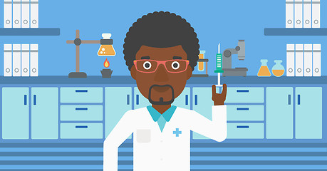 Image showing Laboratory assistant with syringe in lab.