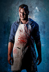 Image showing Bloody Halloween theme: crazy killer as butcher