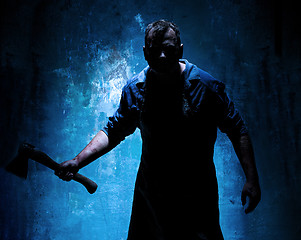 Image showing Bloody Halloween theme: crazy killer as butcher with an ax