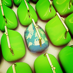 Image showing Purse Earth and purses. On-line concept. 3D illustration. Vintag