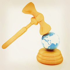 Image showing Wooden gavel and earth isolated on white background. Global auct