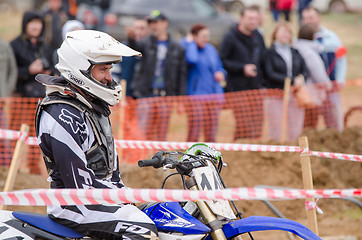 Image showing Volgograd, Russia - April 19, 2015: Motorcycle racer smiles before the start of the competition, at the stage of the Open Championship Motorcycle Cross Country Cup Volgograd Region Governor