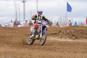 Image showing Volgograd, Russia - April 19, 2015: Motorcycle racer riding on dirt track, at the stage of the Open Championship Motorcycle Cross Country Cup Volgograd Region Governor