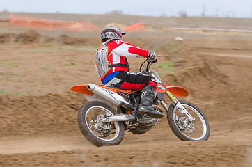 Image showing Volgograd, Russia - April 19, 2015: Motorcycle racer enters a turn into a protracted, step Open Championship Motorcycle Cross Country Cup Volgograd Region Governor