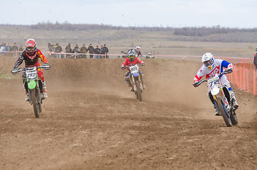 Image showing Volgograd, Russia - April 19, 2015: Three riders on the track, at the stage of the Open Championship Motorcycle Cross Country Cup Volgograd Region Governor