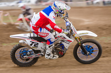 Image showing Volgograd, Russia - April 19, 2015: Motorcycle racer racing on dirt track, at the stage of the Open Championship Motorcycle Cross Country Cup Volgograd Region Governor