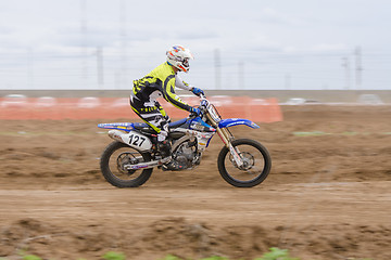 Image showing Volgograd, Russia - April 19, 2015: Motorcycle racer racing on dirt track, at the stage of the Open Championship Motorcycle Cross Country Cup Volgograd Region Governor