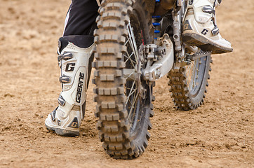 Image showing Volgograd, Russia - April 19, 2015: Rear wheel motorcycle on which sits a motorcycle racer, at the stage of the Open Championship Motorcycle Cross Country Cup Volgograd Region Governor