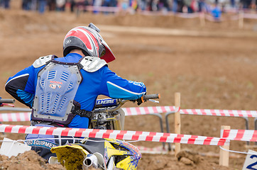 Image showing Volgograd, Russia - April 19, 2015: Motorcycle racer is ready to take the start in the race to stage the Open Championship Motorcycle Cross Country Cup Volgograd Region Governor