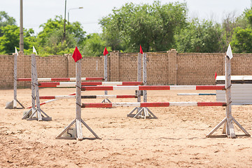 Image showing Barriers to stage equestrian competitions in show jumping style