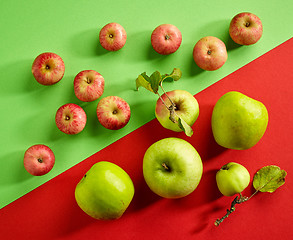 Image showing green and red apples on colorful background