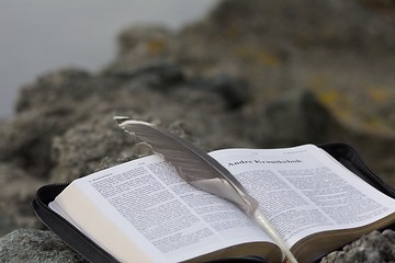Image showing Bible with quill