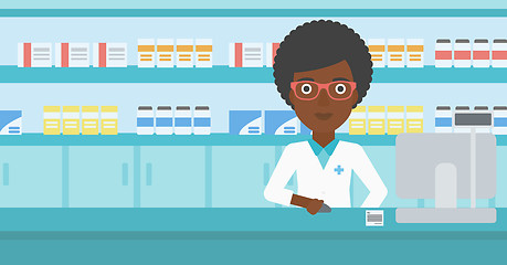 Image showing Pharmacist at counter with computer monitor.