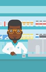 Image showing Pharmacist at counter with cash box.