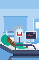 Image showing Patient lying in hospital bed with heart monitor.