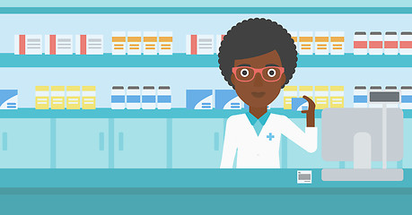 Image showing Pharmacist showing some medicine.