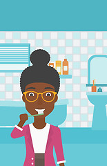 Image showing Woman brushing teeth.