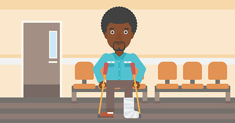 Image showing Man with broken leg and crutches.