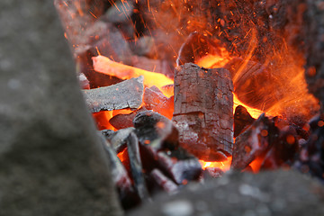 Image showing flaming metal rod